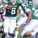 Eastern Michigan junior Alex Gillett looks to hand off the ball during the first quarter against Western Michigan at Rynearson Stadium on Saturday afternoon. Melanie Maxwell I AnnArbor.com
